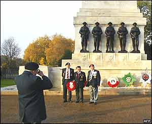 Old soldiers take their own souvenir photograph at the Guards Memorial at Horse Guards Parade