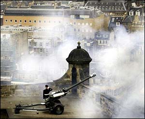 A gun being fired from Edinburgh Castle, Scotland