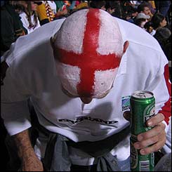 An England fan sporting a George's Cross on their head