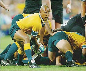 Australian captain George Gregan passes from the base of a maul