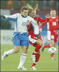 Wales Robbie Savage tangles for the ball with Russia's Alexander Mostovoi