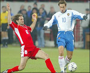 Mostovoi is tackled by Andy Johnson