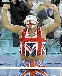 An England fan shows his delight at winning the match against France