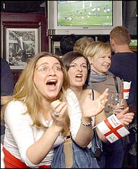 England fans watch the match in a pub in London