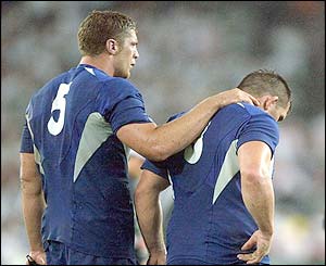 France's Jerome Thion and Sylvain Marconnet contemplate defeat at the final whistle 