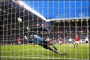 Martin Jorgenson fires a penalty past David James