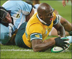 Australia's Wendell Sailor scores a try against Argentina