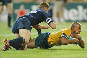 Captain George Gregan scores for Australia against Scotland