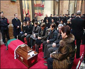 Relatives mourning at the side of a coffin of one of the 19 Italian soldiers and policemen killed in Iraq
