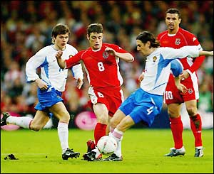 Wales' Jason Koumas makes a run forward