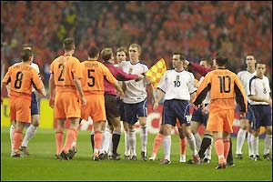 The players square up at the start of the match