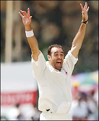 Richard Johnson celebrates the wicket of Sangakarra for 71