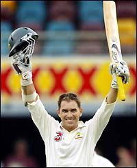Langer celebrates his century against India