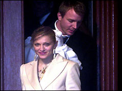 Madonna emerges from Dornoch Cathedral with Guy Ritchie