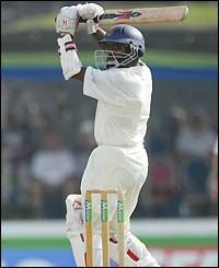 Muttiah Muralitharan shares in a final-wickt partnership of 46 with Mahela Jayawardene