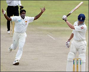 Andrew Flintoff frustratedly waves his bat after being dismissed off a Chaminda Vaas delivery