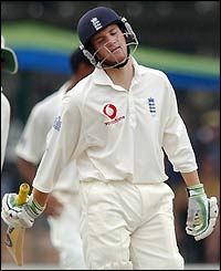 England's Chris Read leaves the field after being dismissed by Murali