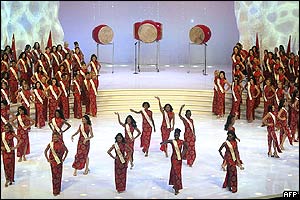 Contestants wave as they parade on stage 