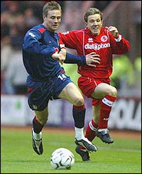 Portsmouth's Matthew Taylor battles with Middlesbrough's Juninho
