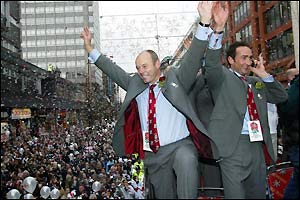 England coach Clive Woodward celebrates with fans