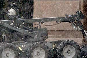 A police robot searches for undetonated explosives