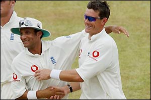 England's Mark Butcher congratulates Ashley Giles