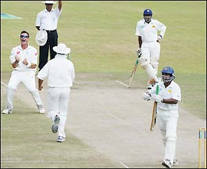 Kumar Sangakkara is dismissed by Ashley Giles