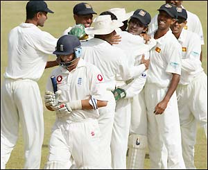 Nasser Hussain walks off the field