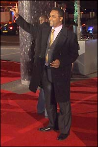 Michael Watson waves to fans