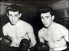 Ronnie and Reggie Kray in boxing shorts 