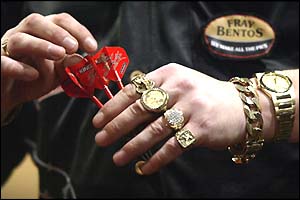 Mervyn King shows off his gold rings