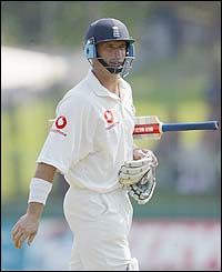 Nasser Hussain walks back to the pavilion