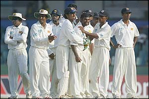 Muttiah Muralitharan celebrates taking the wicket of Andrew Flintoff