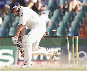 Ashley Giles is bowled by Dilhara Fernando
