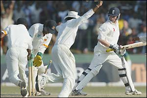 The Sri Lankan fielders remove the stumps after winning the match by dismissing James Kirtley