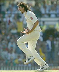 Australia's Jason Gillespie celebrates dismissing India's VVS Laxman