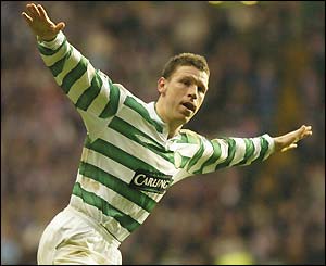 Alan Thompson (right) wheels away in delight after adding a third to seal Celtic's win