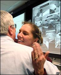 As the first images are beamed through colleagues at Nasa's Jet Propulsion Laboratory in Pasadena, California celebrate