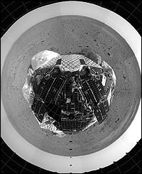 The pictures show the barren, rock-strewn landscape surrounding the Spirit lander