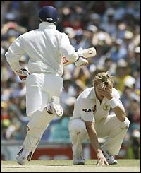 Australian fast bowler Brett Lee (right) holds his head in his hands after a catch is dropped