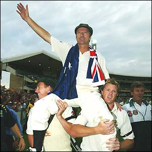 His Australian team-mates carry their retiring captain Steve Waugh on a lap of honour