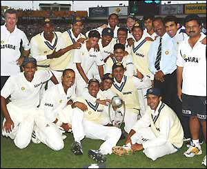 The Indian team pose with the Border-Gavaskar series trophy, which they retain after the series is drawn