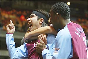 Juan Pablo Angel is congratulated by his team mates