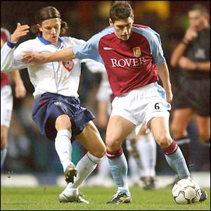 Gareth Barry collides with a Portsmouth defender