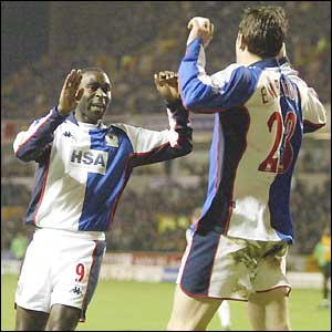 Andy Cole is congratulated by team-mate Brett Emerson