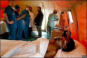 Man known as Jalil, age 56, in a field hospital following his rescue from the Bam rubble, 8 January 2004