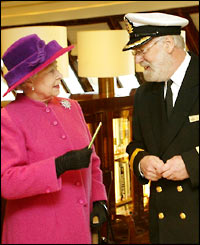 Queen Elizabeth on the bridge of the Queen Mary 2