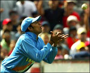 India's VVS Laxman prepares to catch Australia's Michael Clarke