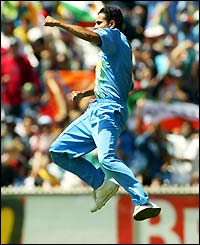 India's Irfan Pathan jumps for joy after catching Australia's Adam Gilchrist