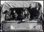 Troops waving from back of army truck